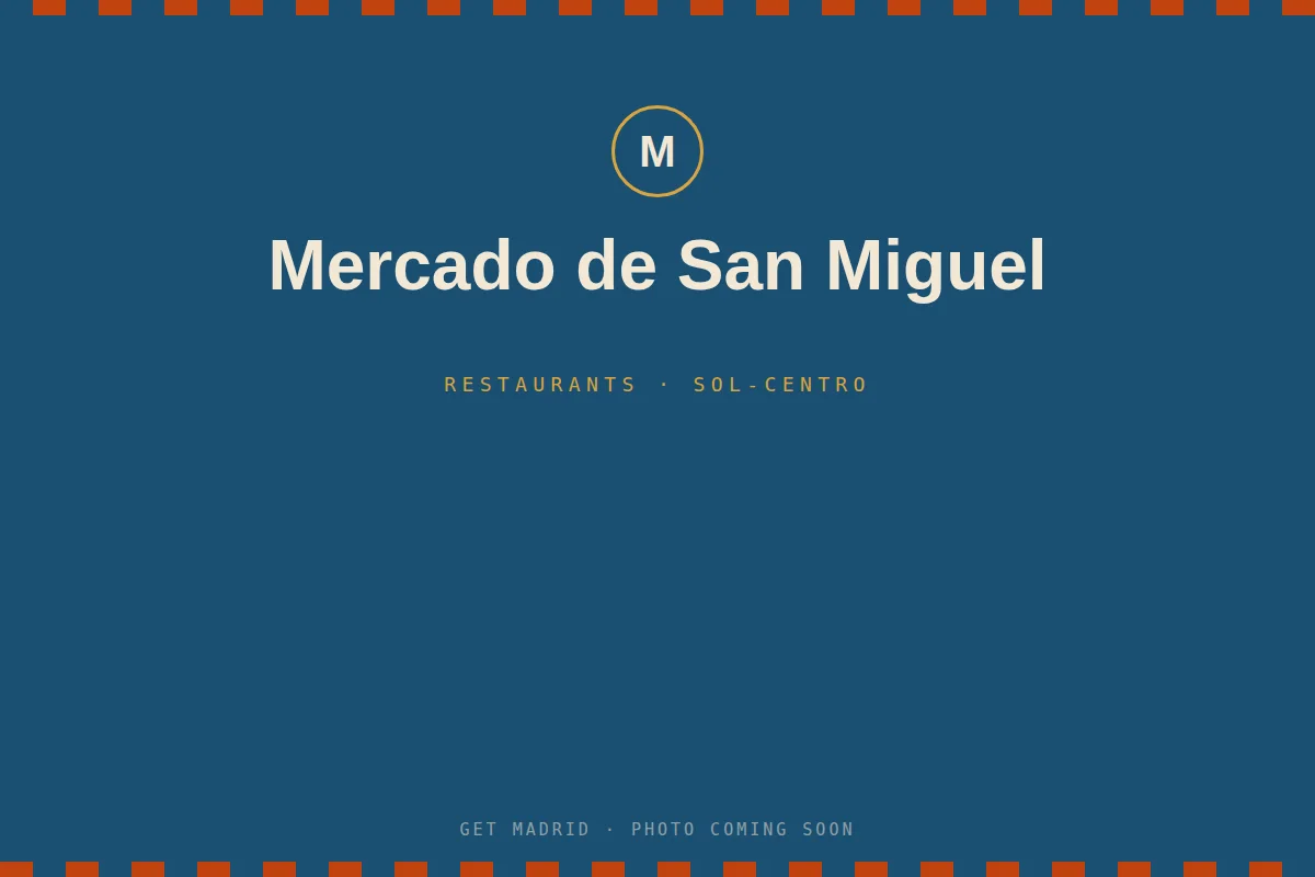 Tapas counters and glass roof inside the Mercado de San Miguel food hall in Madrid