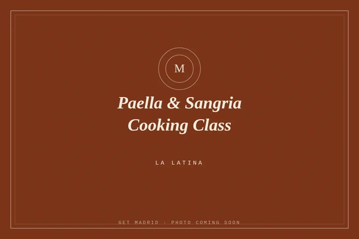 Hands mid-stir over a wide pan of paella during a Madrid cooking class