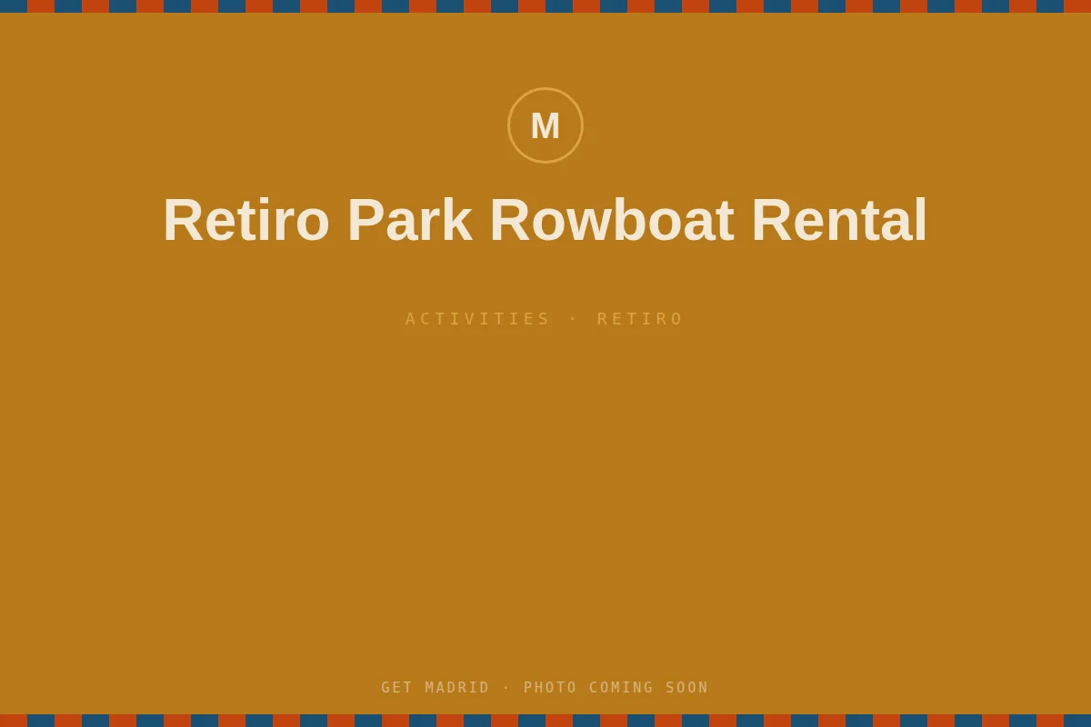 Rowboats on the lake in Retiro Park with the Alfonso XII monument behind